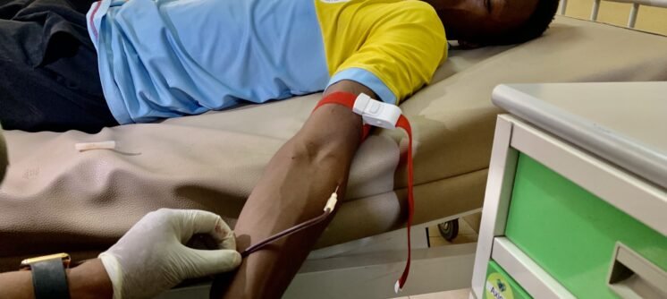 donor donating blood at blood cells rescue initiative